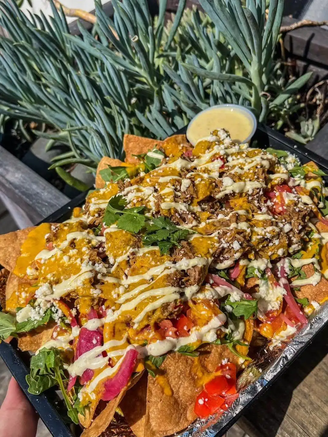Street tacos on a slate board at Dragonfly Tavern